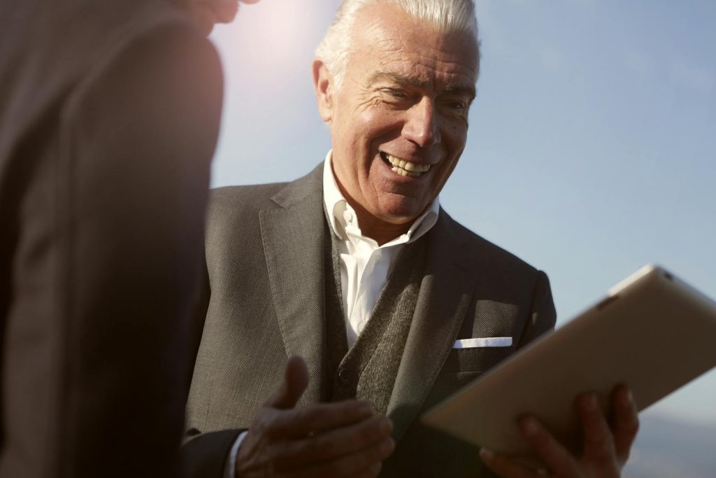 Senior businessman smiling made the right choice of working on mission-based jobs