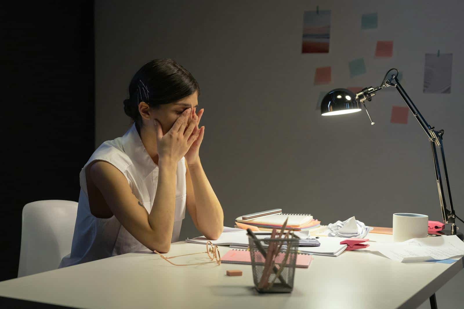 A stressed businesswoman before navigating psychological shift toward entrepreneurship