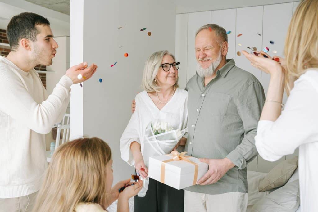 Fulfilled elderly couple receives gifts and love from family because they broke free from golden handcuffs early in life